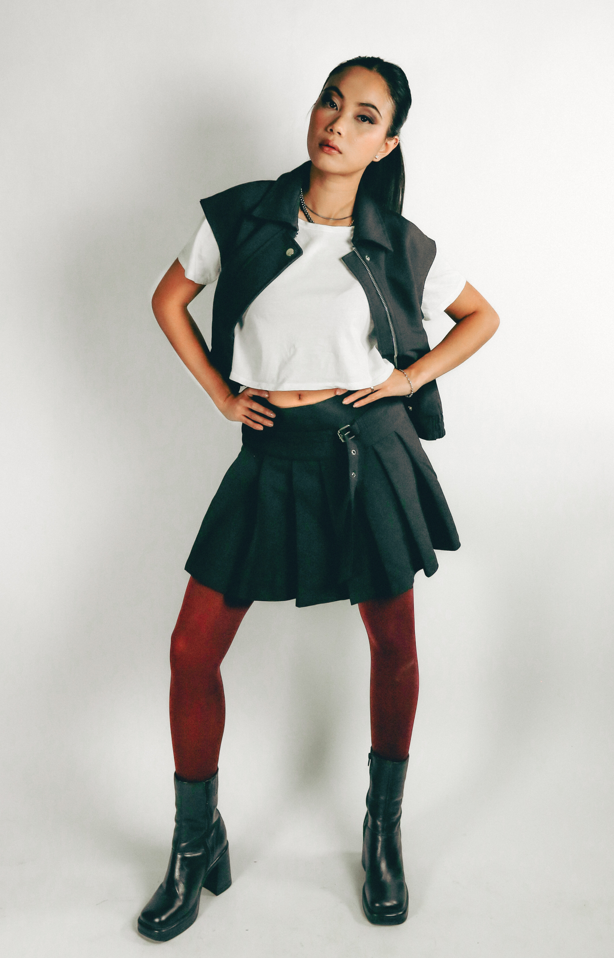Elevate your wardrobe with the Jen Pleated Mini Skirt, where chic style meets modern design. This tailored skirt features flattering pleats and a self belt that adds a touch of sophistication to your look. Designed with a convenient side zipper, the Jen Mini Skirt combines functionality with a trendy silhouette. Effortlessly stylish, it’s perfect for creating fashionable outfits that stand out. Step out in confidence with this must-have mini skirt that embodies a hip, contemporary vibe.