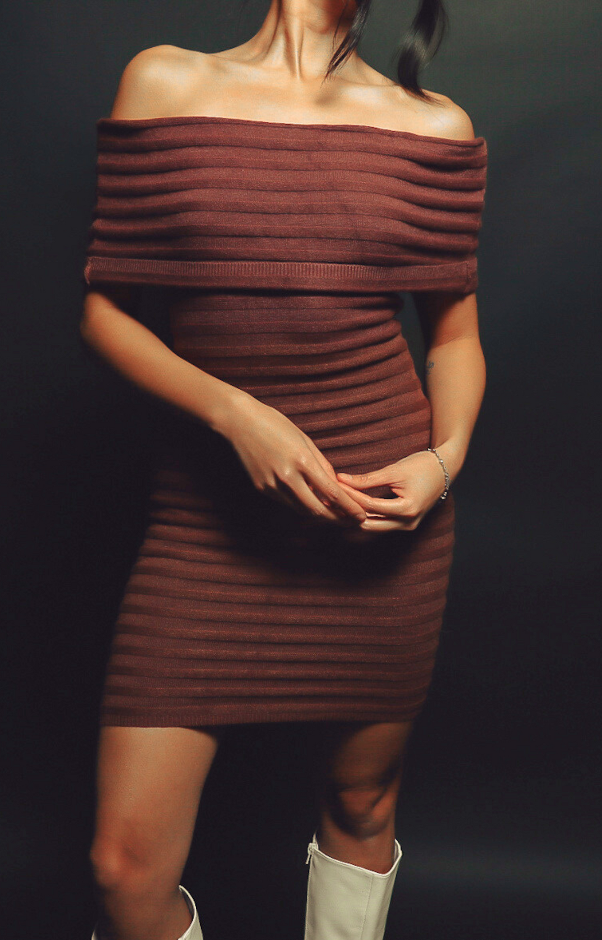 Make a statement with the Theo Off-Shoulder Knit Dress in rich dark chocolate hue. Featuring a chic off-shoulder neckline and subtle stripe pattern, this dress exudes elegance and sophistication. Crafted from ultra-soft, stretchy knit fabric, it offers a flattering fit that's both comfortable and classy. Perfect for date nights, holiday parties, or upscale casual events, the Theo dress is your go-to for effortless style.&nbsp;