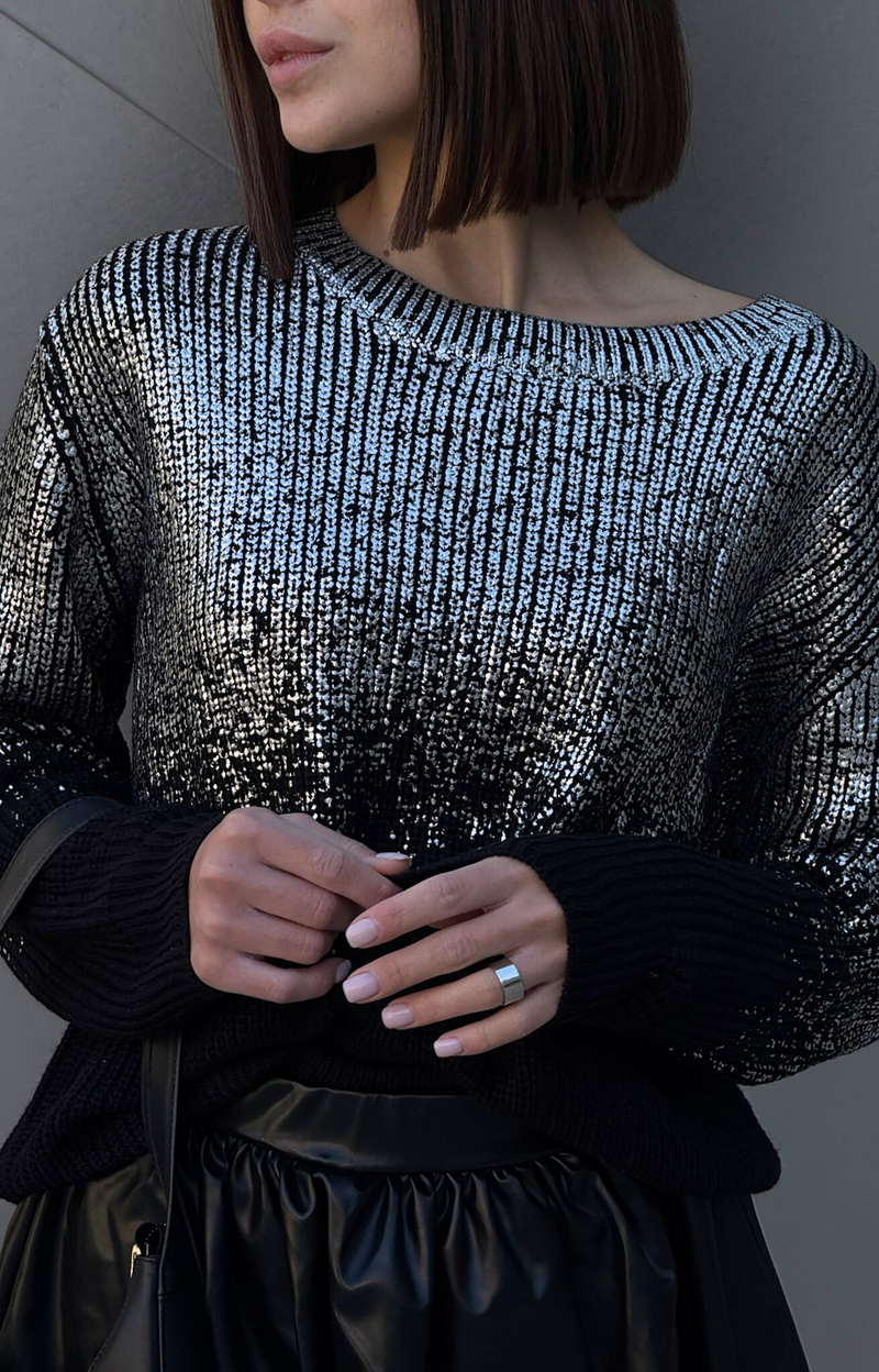 Turn heads with the Rita Metallic Sweater, your ultimate wardrobe upgrade. Designed with luxurious foil metallic finish, this chic and elevated piece effortlessly transitions from casual daytime looks to dazzling nights out. Pair it with jeans for a laid-back glam or dress it up with skirts for a night on the town. Add a touch of sparkle to your outfit with our Rita metallic Sweater.