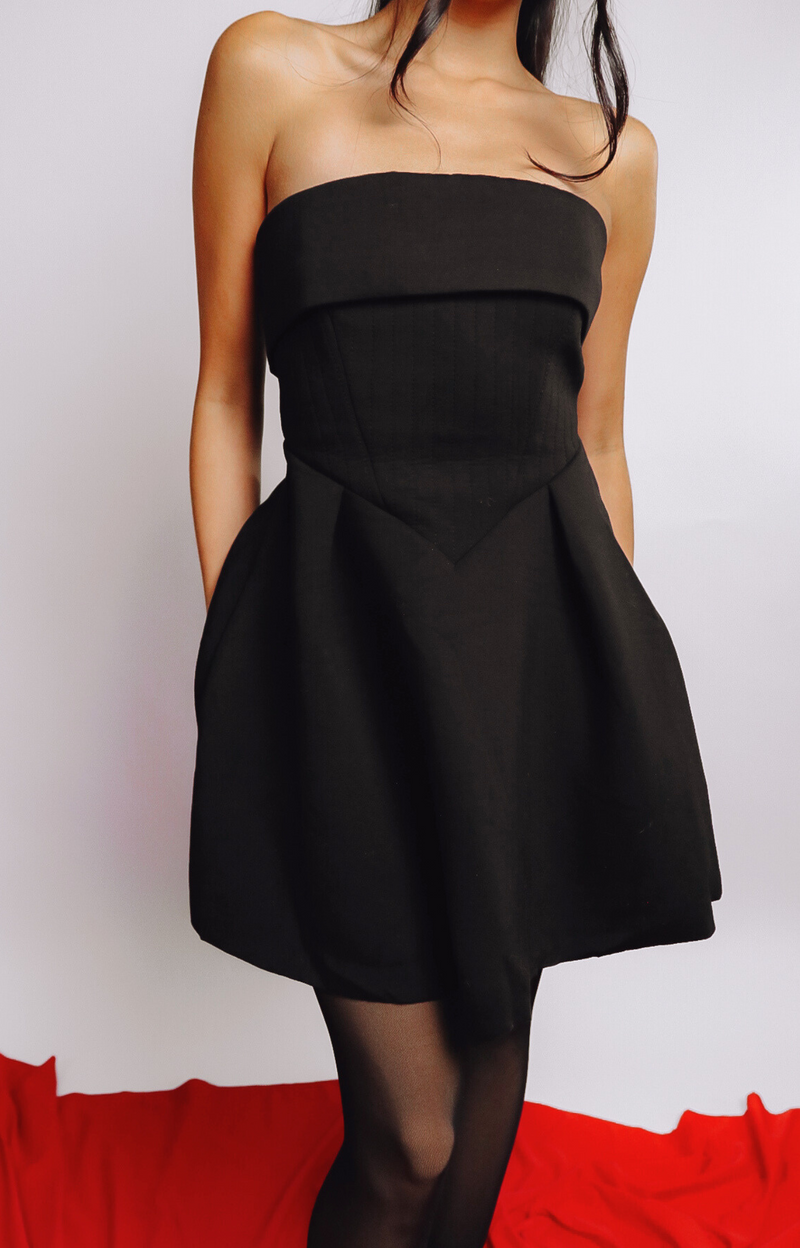 The Cora Strapless Mini Dress is the ultimate little black dress for every occasion. Made with stretchy fabric, and a chic, timeless design, it's perfect for date night, parties, and special events. Flattering and versatile, the Cora dress will have you looking effortlessly elegant anytime, anywhere.