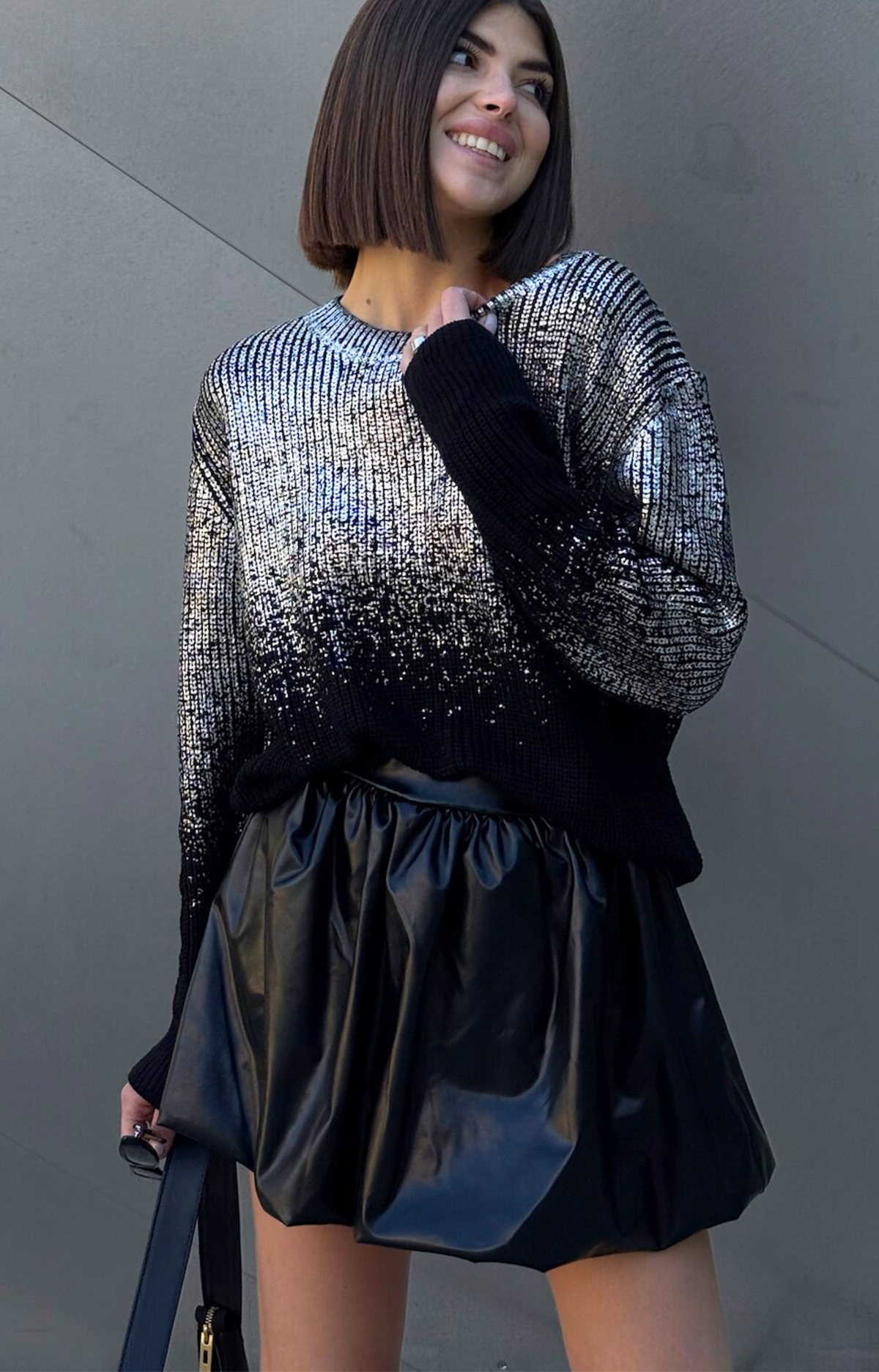 Discover the Ariel Faux Leather Bubble Mini Skirt, featuring a super cute design, elastic waistband, and comfortable fit. Elevate your wardrobe with this edgy and chic skirt that's perfect for any occasion!