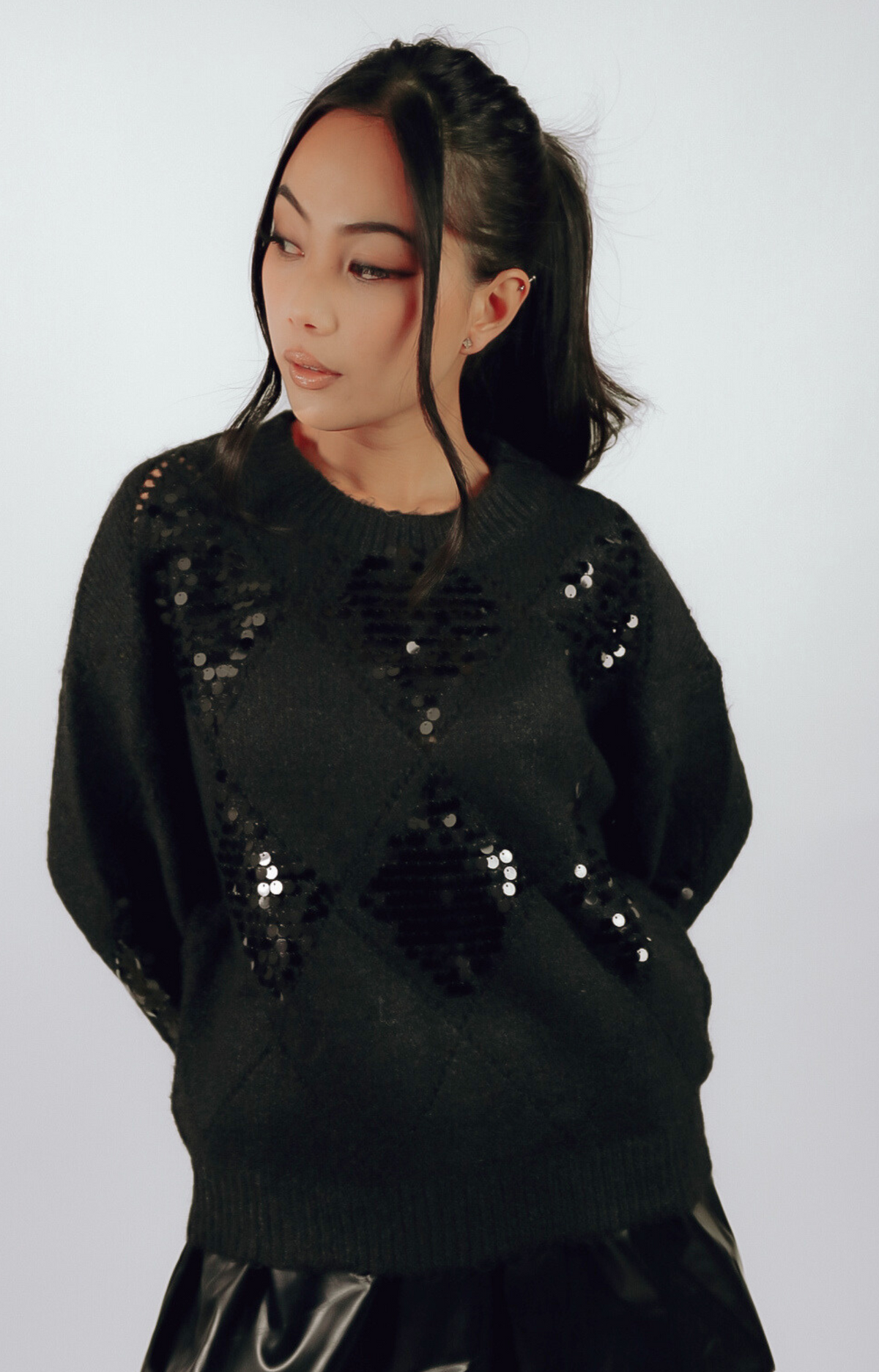 Elevate your holiday wardrobe with the Julia Sequined Knit Sweater. This ultra-soft knit blends cozy comfort with chic sequined details, making it the perfect choice for festive gatherings or casual outings. Dress it up with a sleek skirt or keep it relaxed with your favorite jeans. Versatile, stylish, and holiday-ready, the Julia sweater is a must-have for a touch of sparkle this season.