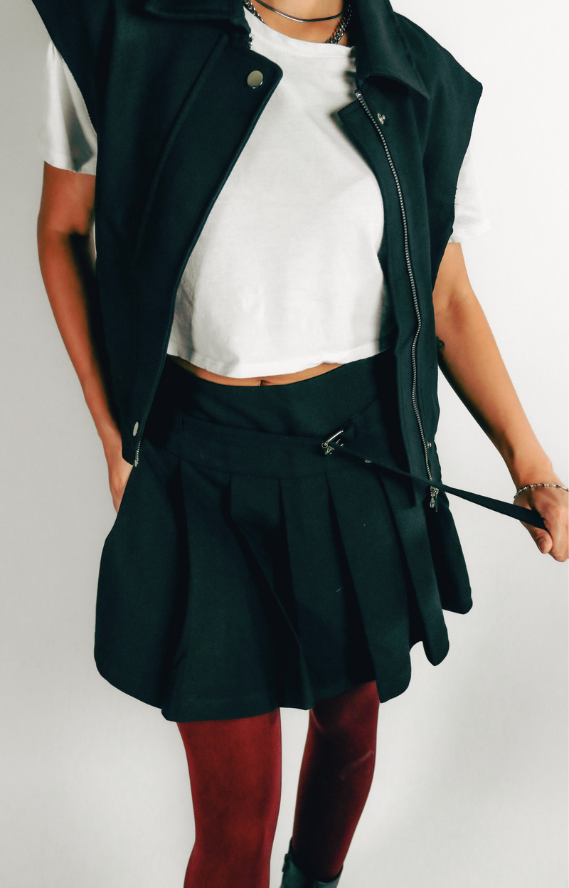 Elevate your wardrobe with the Jen Pleated Mini Skirt, where chic style meets modern design. This tailored skirt features flattering pleats and a self belt that adds a touch of sophistication to your look. Designed with a convenient side zipper, the Jen Mini Skirt combines functionality with a trendy silhouette. Effortlessly stylish, it’s perfect for creating fashionable outfits that stand out. Step out in confidence with this must-have mini skirt that embodies a hip, contemporary vibe.