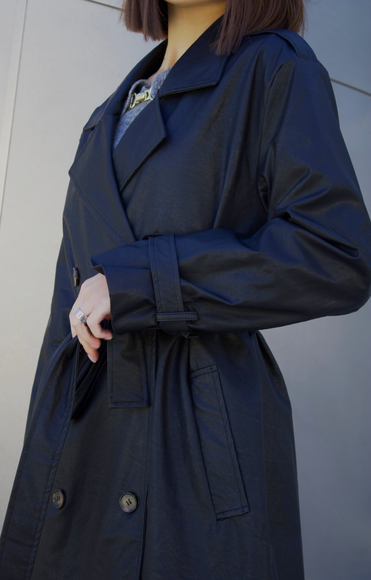 Step out in style with our Kylie Faux Leather Trench Coat, expertly crafted from high-quality faux leather that mimics the rich texture and sheen of genuine leather. This chic coat not only adds a touch of sophistication to any outfit but also provides a cruelty-free alternative that you can feel good about wearing.&nbsp;Featuring premium faux leather fabric, deep pockets, and a fashionable belt.