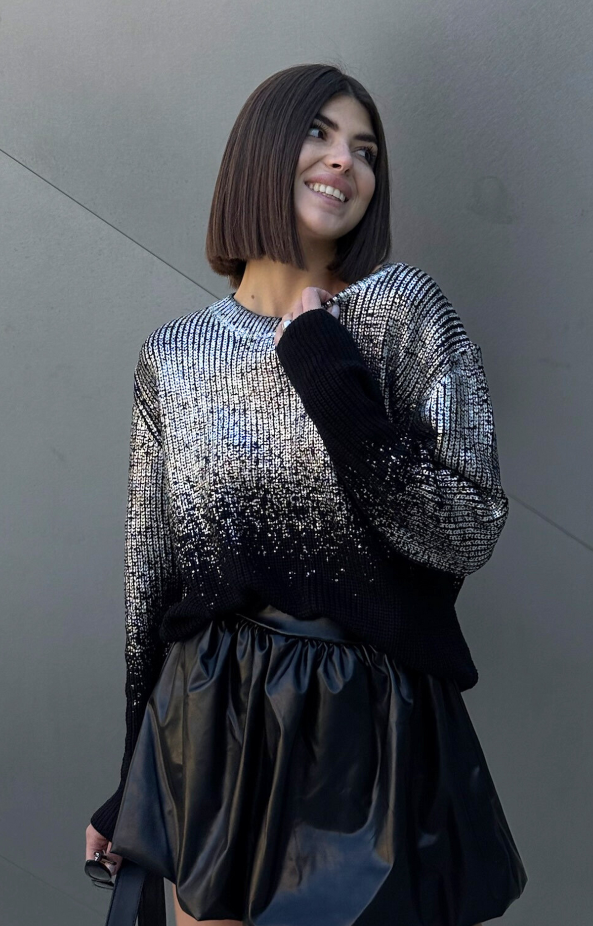 Turn heads with the Rita Metallic Sweater, your ultimate wardrobe upgrade. Designed with luxurious foil metallic finish, this chic and elevated piece effortlessly transitions from casual daytime looks to dazzling nights out. Pair it with jeans for a laid-back glam or dress it up with skirts for a night on the town. Add a touch of sparkle to your outfit with our Rita metallic Sweater.