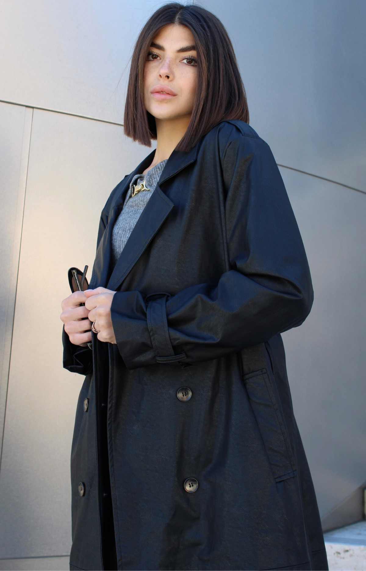 Step out in style with our Kylie Faux Leather Trench Coat, expertly crafted from high-quality faux leather that mimics the rich texture and sheen of genuine leather. This chic coat not only adds a touch of sophistication to any outfit but also provides a cruelty-free alternative that you can feel good about wearing.&nbsp;Featuring premium faux leather fabric, deep pockets, and a fashionable belt.