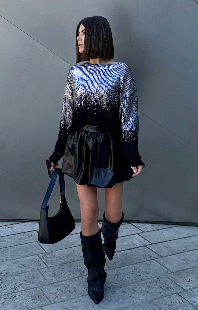 Discover the Ariel Faux Leather Bubble Mini Skirt, featuring a super cute design, elastic waistband, and comfortable fit. Elevate your wardrobe with this edgy and chic skirt that's perfect for any occasion!