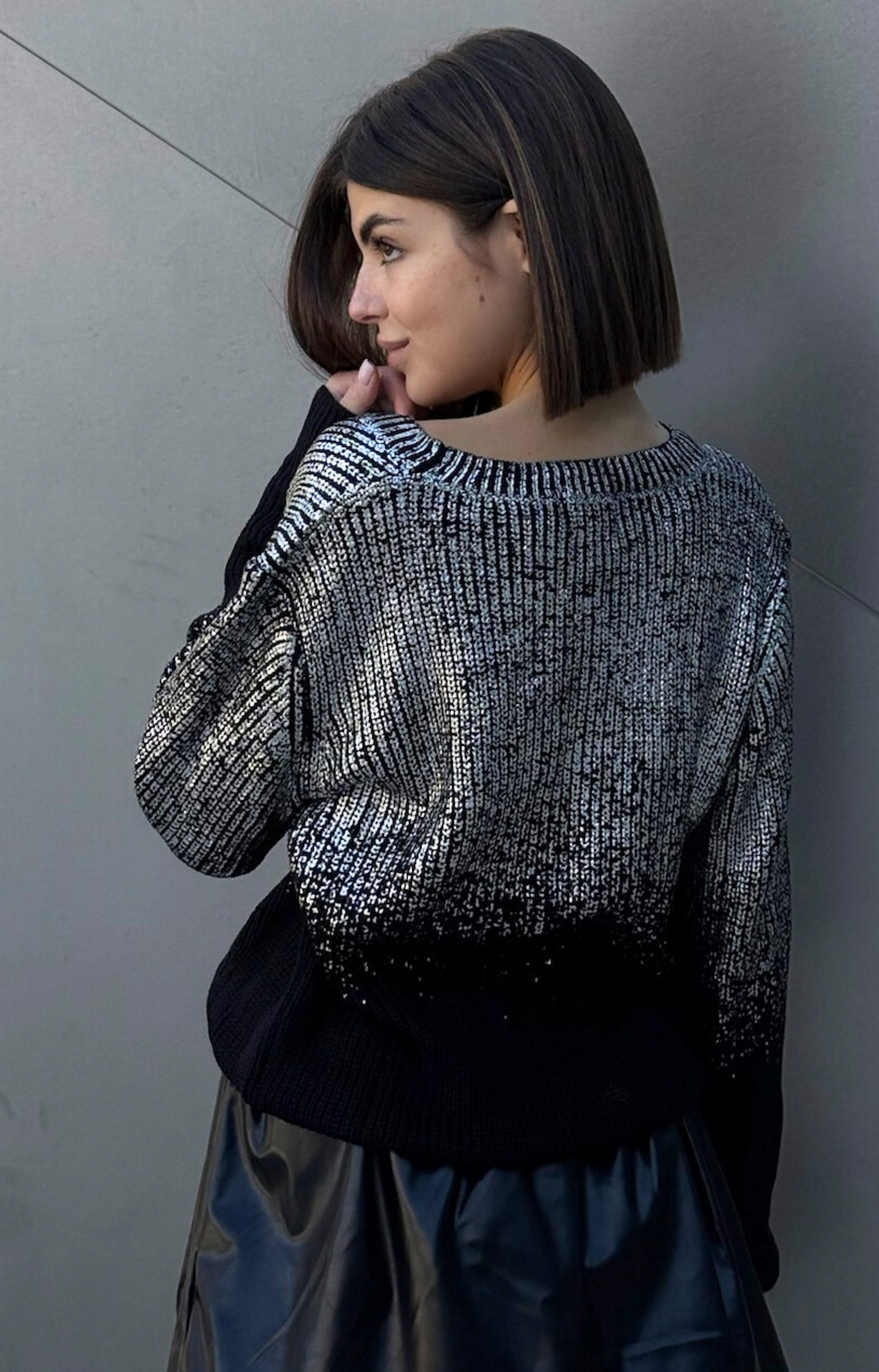 Turn heads with the Rita Metallic Sweater, your ultimate wardrobe upgrade. Designed with luxurious foil metallic finish, this chic and elevated piece effortlessly transitions from casual daytime looks to dazzling nights out. Pair it with jeans for a laid-back glam or dress it up with skirts for a night on the town. Add a touch of sparkle to your outfit with our Rita metallic Sweater.