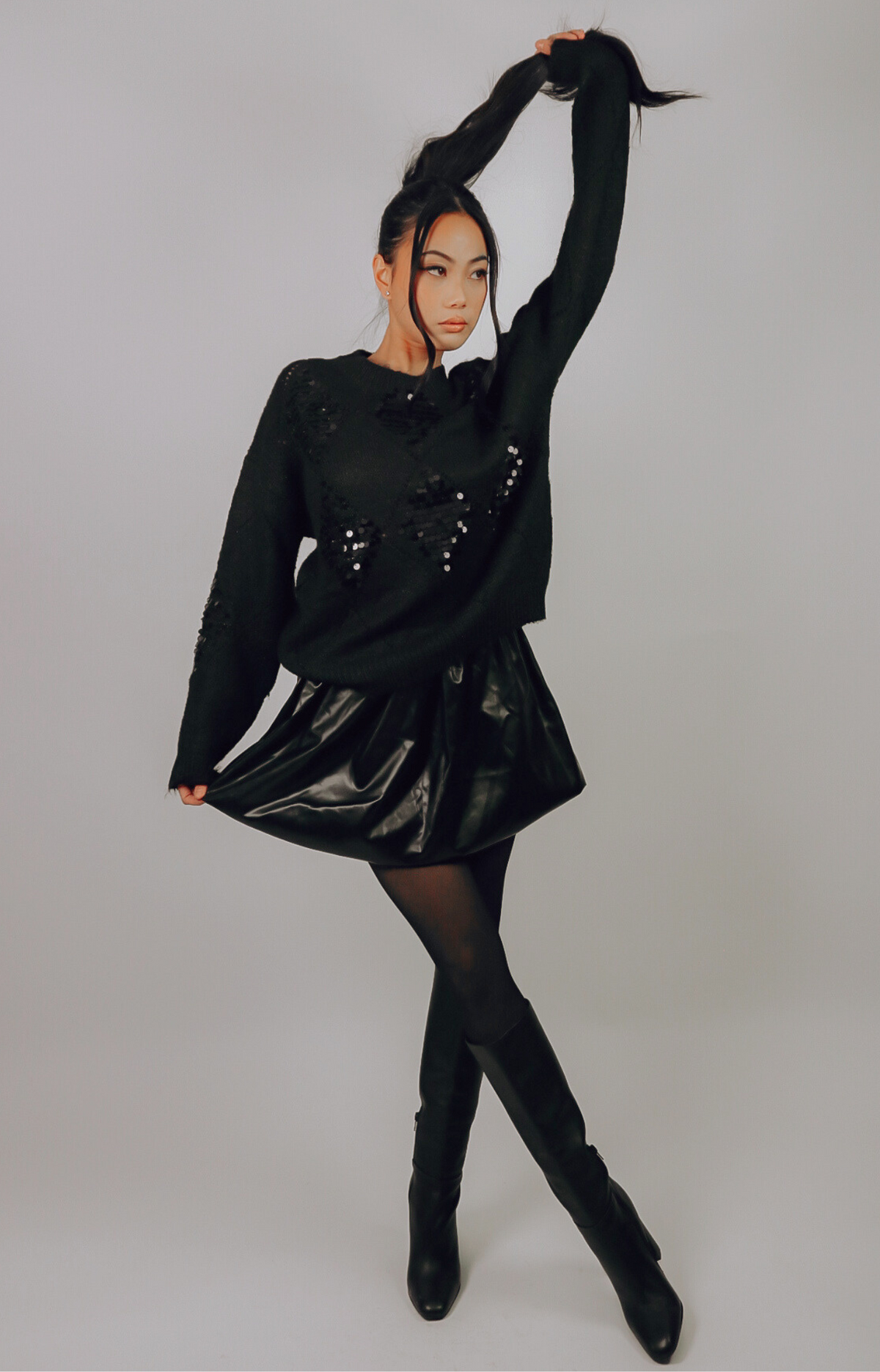 Discover the Ariel Faux Leather Bubble Mini Skirt, featuring a super cute design, elastic waistband, and comfortable fit. Elevate your wardrobe with this edgy and chic skirt that's perfect for any occasion!