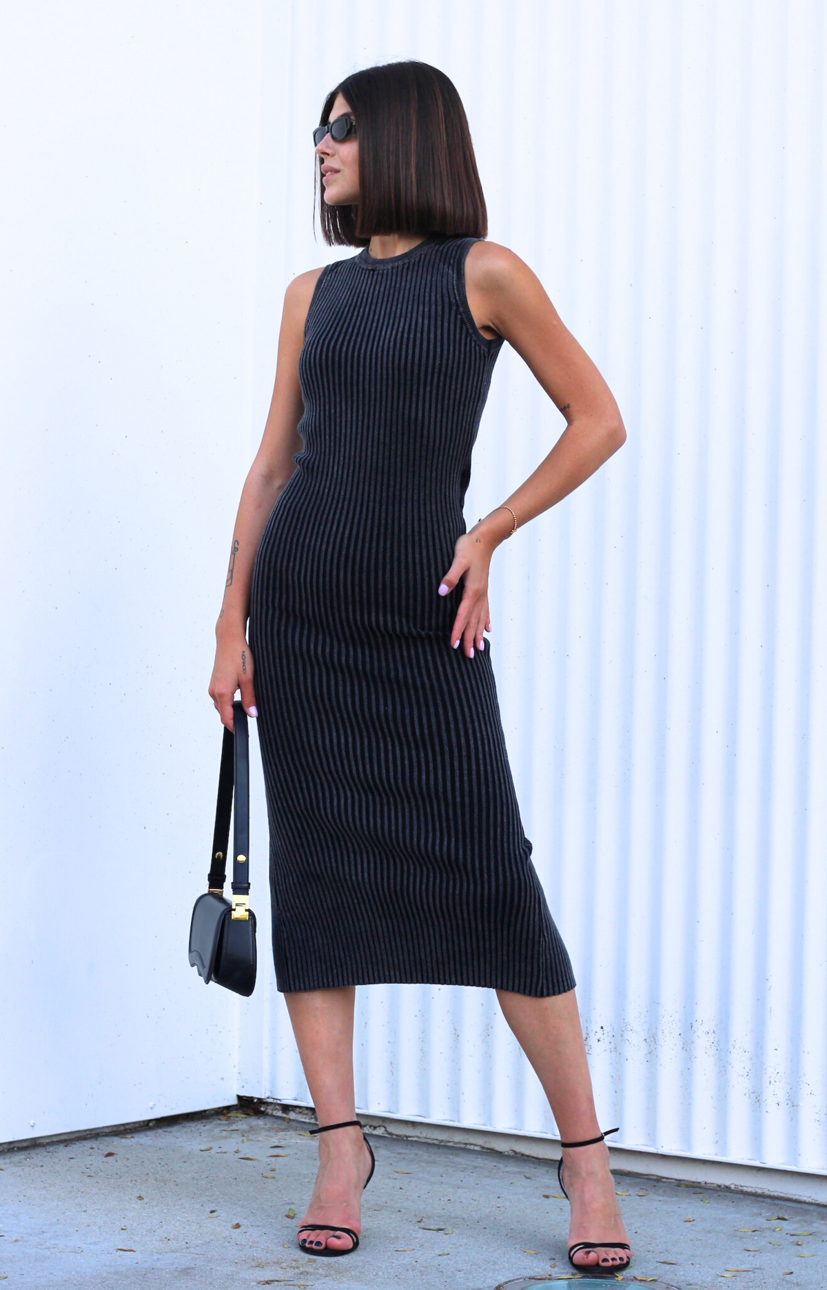 Discover our chic The Icon rib maxi dress in a stunning washed charcoal color, perfect for any occasion. Crafted from an amazing stretchy fabric, this rib dress offers comfort and style, hugging your curves beautifully. The elegant back keyhole detail adds a touch of sophistication, making it a must-have addition to your wardrobe. Perfect for dressing up or down, this versatile maxi rib dress is ideal for day-to-night transitions.&nbsp;
