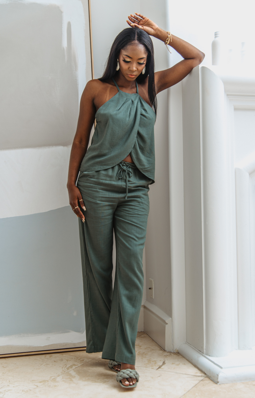 Meet the Mabel Linen Drawstring Pant - your go-to for effortless summer style. This straight-leg linen pant with a drawstring offers chic versatility, perfect for casual or dressed-up looks. Pair with our Mabel Halter Neck Linen Top for a complete ensemble.