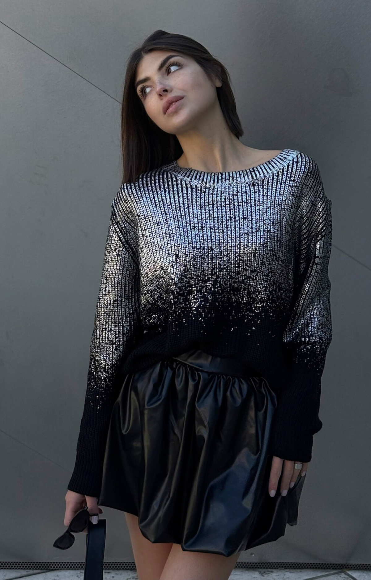 Turn heads with the Rita Metallic Sweater, your ultimate wardrobe upgrade. Designed with luxurious foil metallic finish, this chic and elevated piece effortlessly transitions from casual daytime looks to dazzling nights out. Pair it with jeans for a laid-back glam or dress it up with skirts for a night on the town. Add a touch of sparkle to your outfit with our Rita metallic Sweater.
