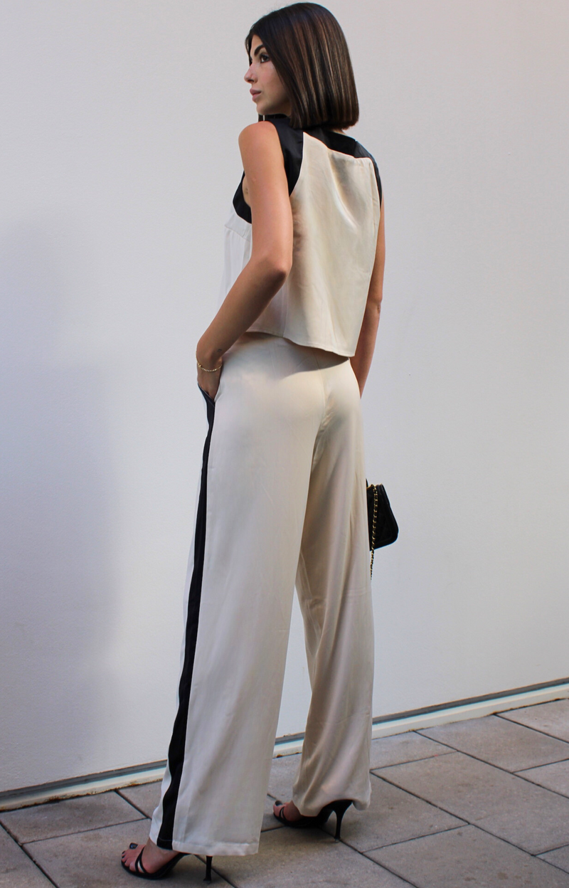 Elevate your wardrobe with our Tiera Tailored long satin feel pants, designed for both style and comfort. Featuring a straight leg cut for a flattering silhouette, this tailored pant includes practical pockets and stylish front pleats that enhance the fit. Crafted from luxurious fabric with eye-catching color block detail, they are perfect for any occasion, from casual outings to sophisticated events. Discover the perfect blend of elegance and functionality with our stunning Tiera Tailored Pant.