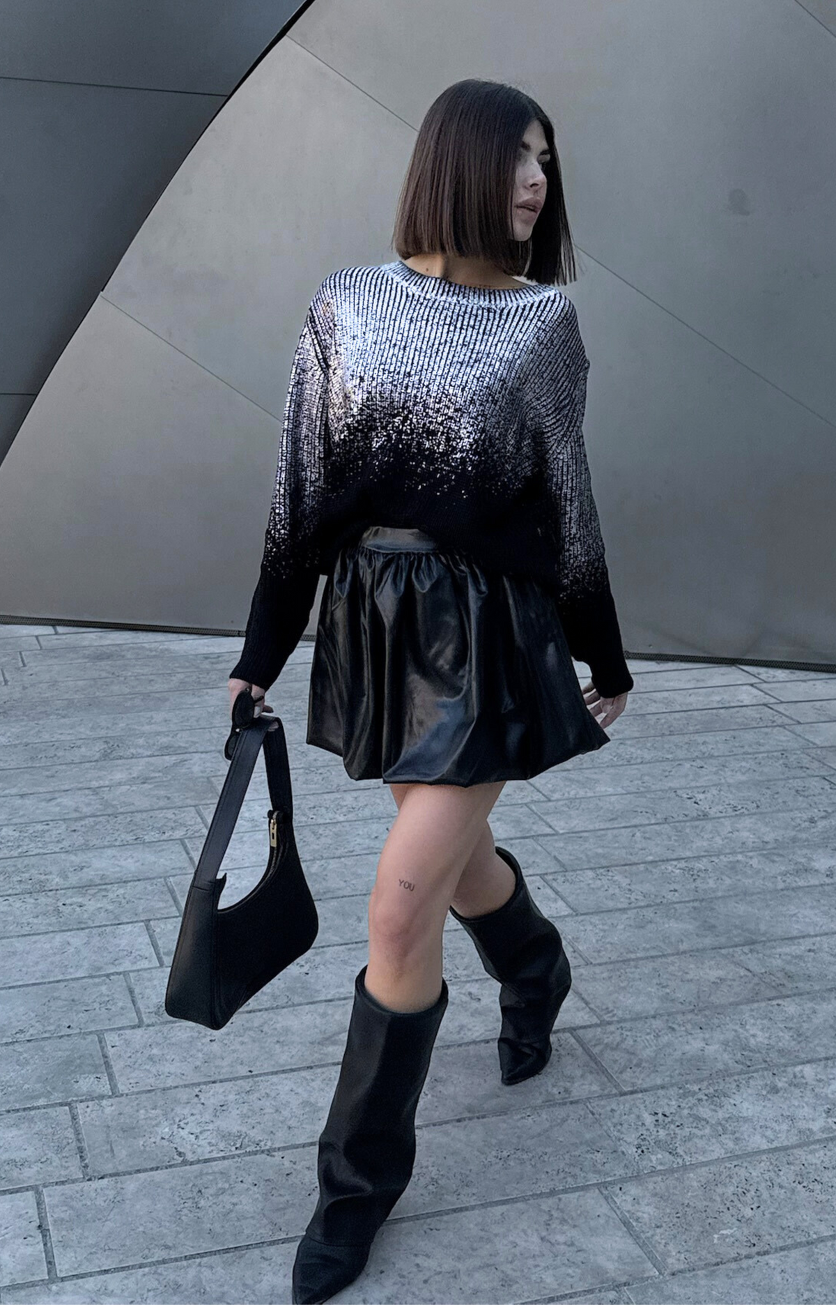 Turn heads with the Rita Metallic Sweater, your ultimate wardrobe upgrade. Designed with luxurious foil metallic finish, this chic and elevated piece effortlessly transitions from casual daytime looks to dazzling nights out. Pair it with jeans for a laid-back glam or dress it up with skirts for a night on the town. Add a touch of sparkle to your outfit with our Rita metallic Sweater.