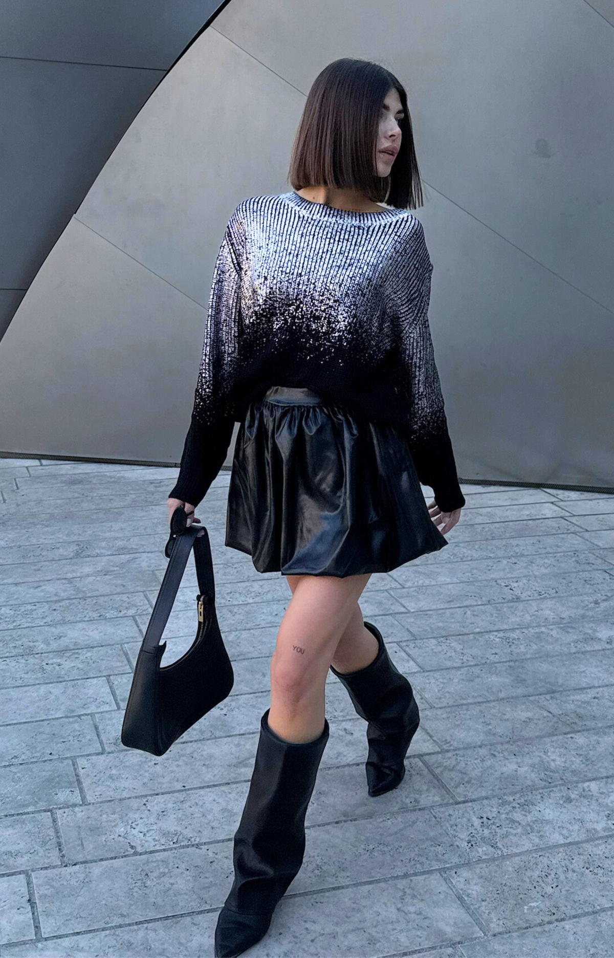 Discover the Ariel Faux Leather Bubble Mini Skirt, featuring a super cute design, elastic waistband, and comfortable fit. Elevate your wardrobe with this edgy and chic skirt that's perfect for any occasion!