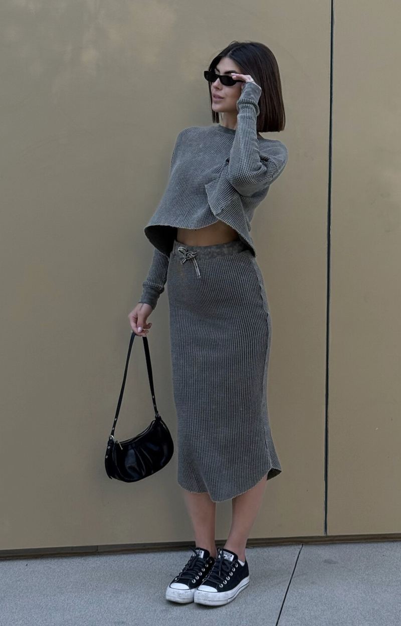 Discover the Tina Rib Long Sleeve Knit Top, crafted from soft cotton fabric for ultimate comfort. Featuring rib cuffs and an easy-wear design, this stylish rib knit top is perfect for any occasion. Pair it with the matching Tina Rib Knit Skirt for a complete look!