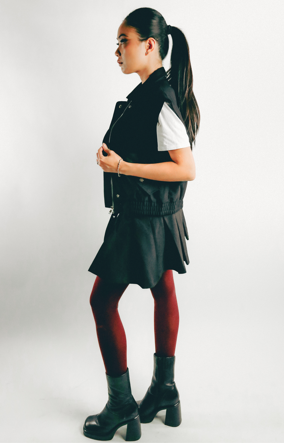 Elevate your wardrobe with the Jen Pleated Mini Skirt, where chic style meets modern design. This tailored skirt features flattering pleats and a self belt that adds a touch of sophistication to your look. Designed with a convenient side zipper, the Jen Mini Skirt combines functionality with a trendy silhouette. Effortlessly stylish, it’s perfect for creating fashionable outfits that stand out. Step out in confidence with this must-have mini skirt that embodies a hip, contemporary vibe.