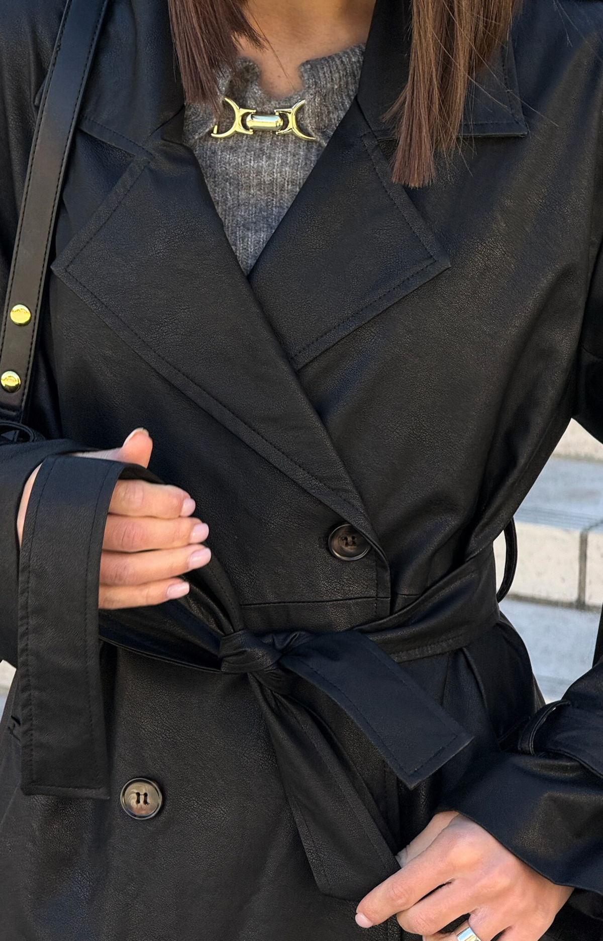 Step out in style with our Kylie Faux Leather Trench Coat, expertly crafted from high-quality faux leather that mimics the rich texture and sheen of genuine leather. This chic coat not only adds a touch of sophistication to any outfit but also provides a cruelty-free alternative that you can feel good about wearing.&nbsp;Featuring premium faux leather fabric, deep pockets, and a fashionable belt.