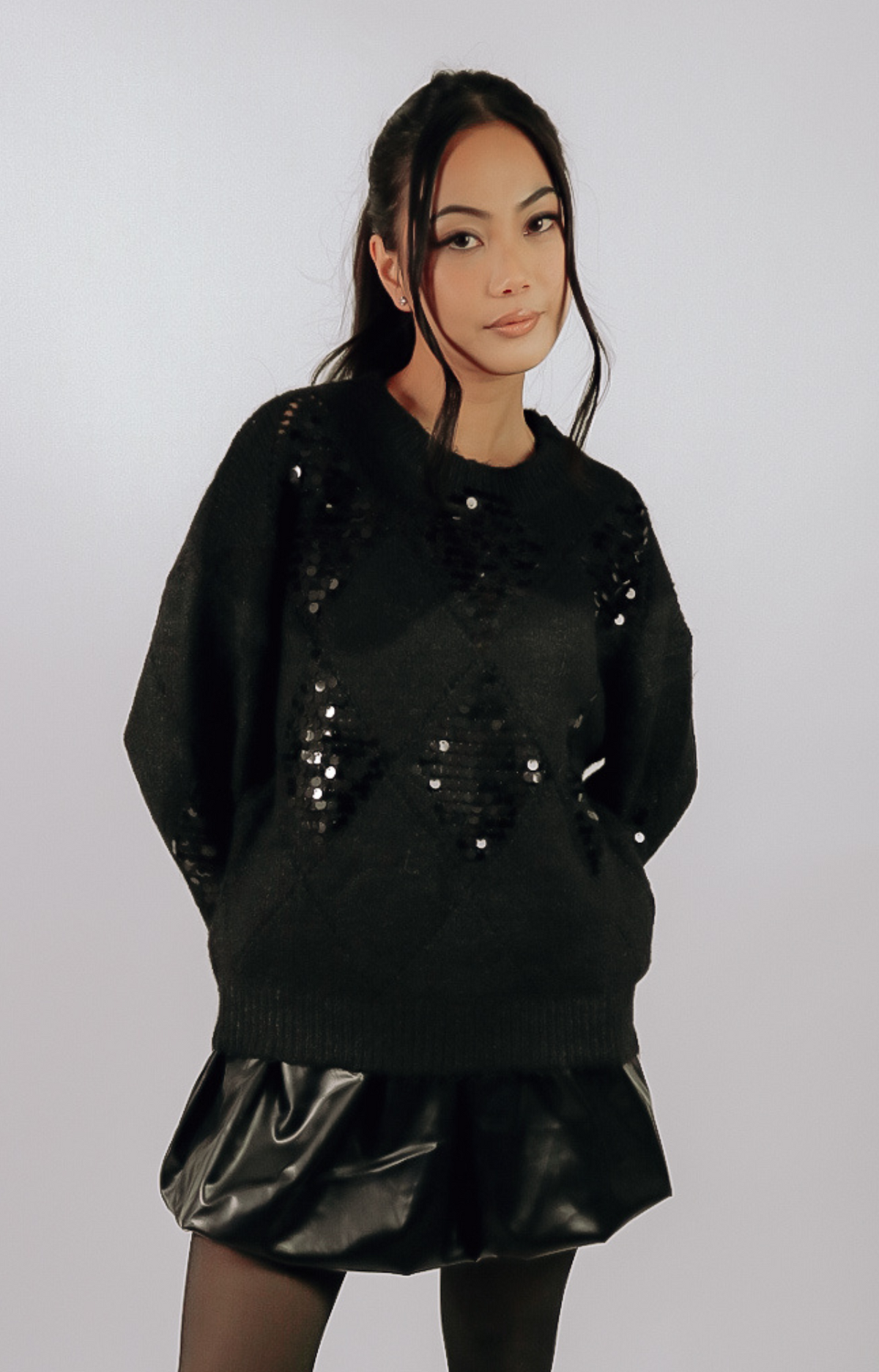 Elevate your holiday wardrobe with the Julia Sequined Knit Sweater. This ultra-soft knit blends cozy comfort with chic sequined details, making it the perfect choice for festive gatherings or casual outings. Dress it up with a sleek skirt or keep it relaxed with your favorite jeans. Versatile, stylish, and holiday-ready, the Julia sweater is a must-have for a touch of sparkle this season.