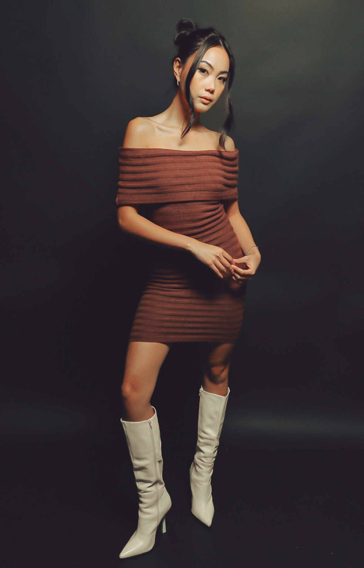 Make a statement with the Theo Off-Shoulder Knit Dress in rich dark chocolate hue. Featuring a chic off-shoulder neckline and subtle stripe pattern, this dress exudes elegance and sophistication. Crafted from ultra-soft, stretchy knit fabric, it offers a flattering fit that's both comfortable and classy. Perfect for date nights, holiday parties, or upscale casual events, the Theo dress is your go-to for effortless style.&nbsp;