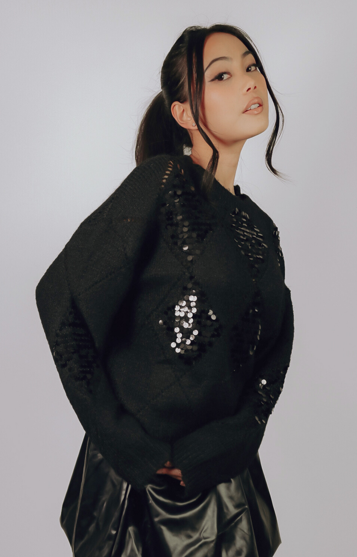 Elevate your holiday wardrobe with the Julia Sequined Knit Sweater. This ultra-soft knit blends cozy comfort with chic sequined details, making it the perfect choice for festive gatherings or casual outings. Dress it up with a sleek skirt or keep it relaxed with your favorite jeans. Versatile, stylish, and holiday-ready, the Julia sweater is a must-have for a touch of sparkle this season.