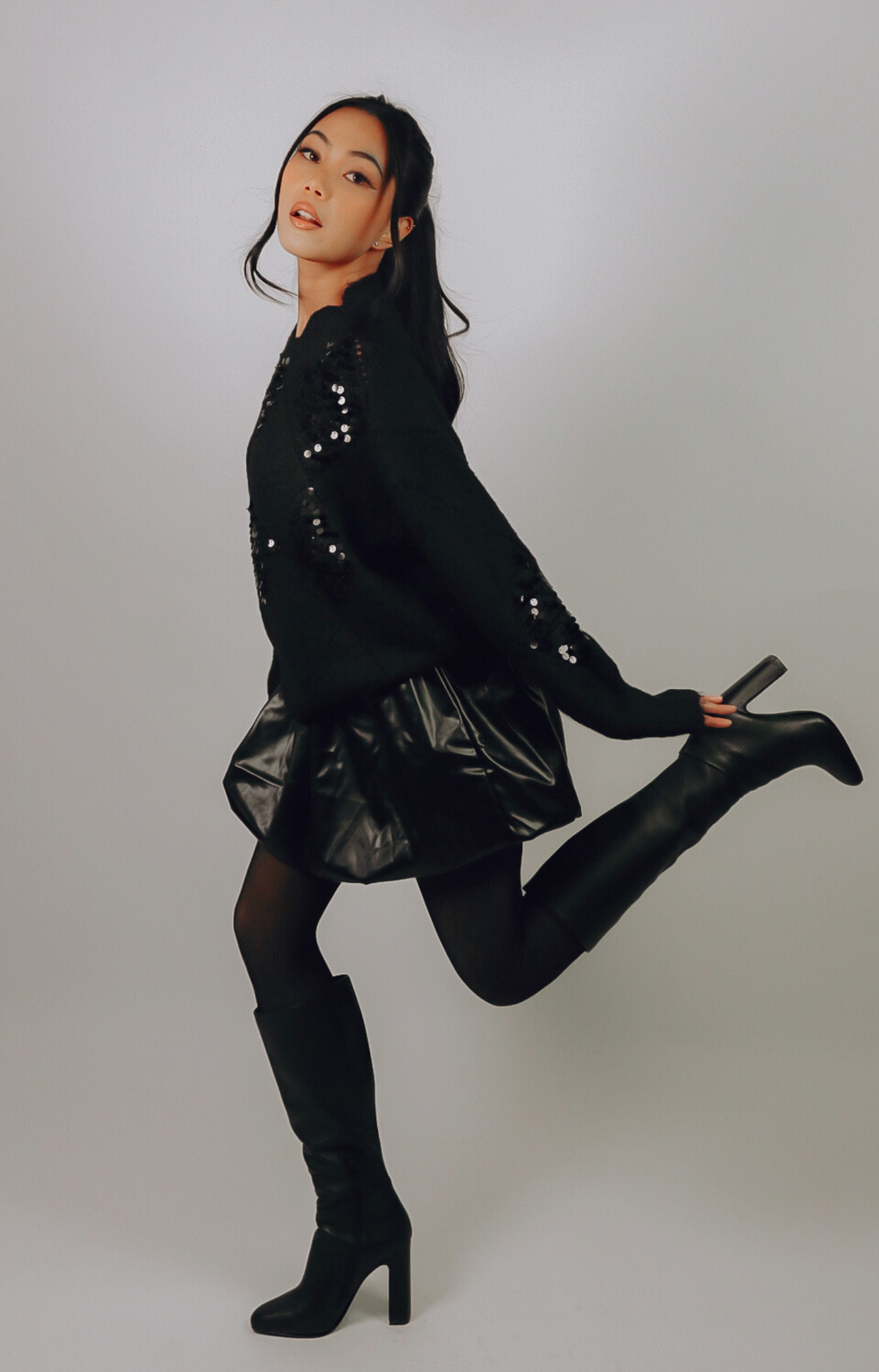 Discover the Ariel Faux Leather Bubble Mini Skirt, featuring a super cute design, elastic waistband, and comfortable fit. Elevate your wardrobe with this edgy and chic skirt that's perfect for any occasion!