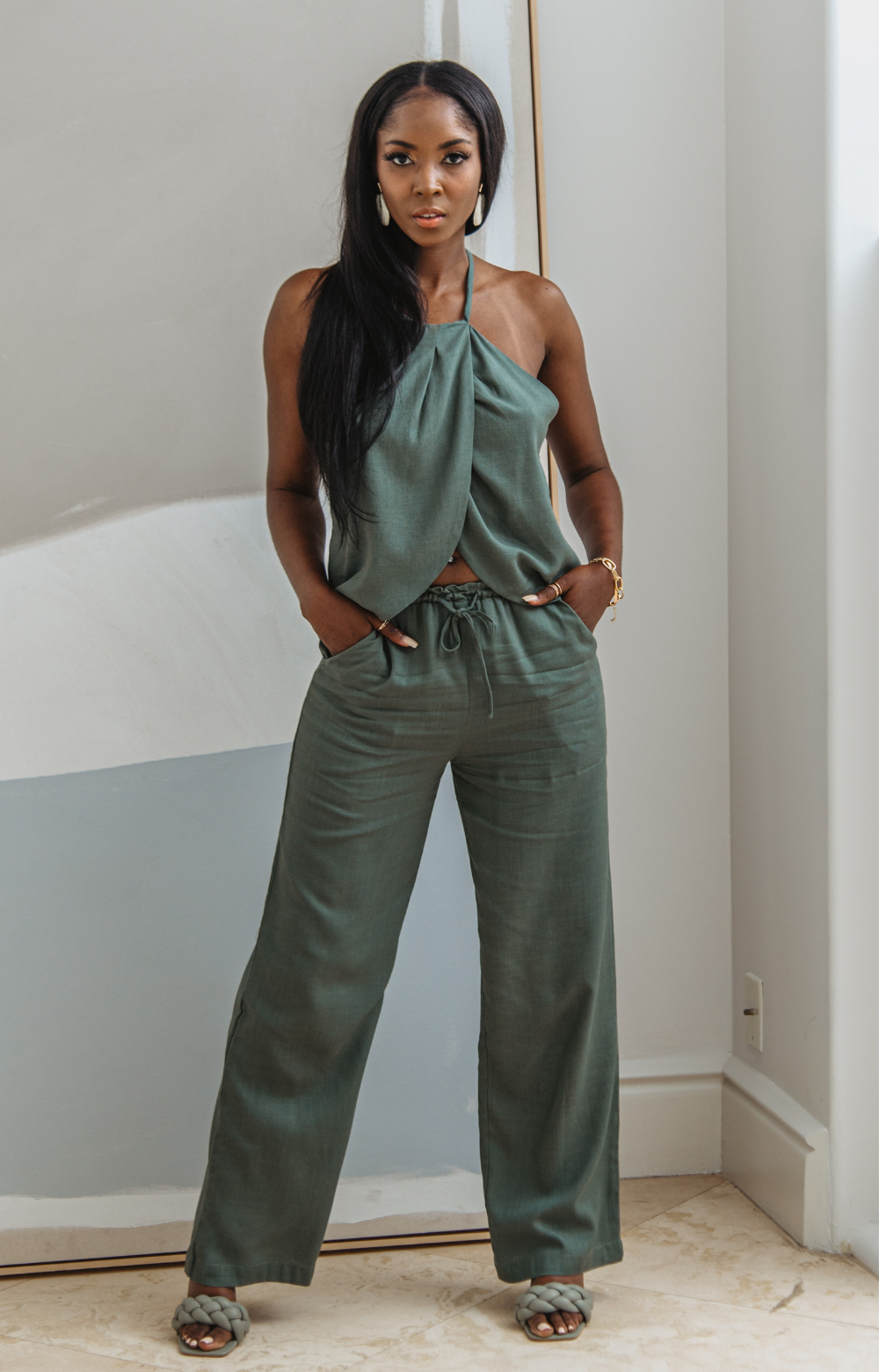 Meet the Mabel Linen Drawstring Pant - your go-to for effortless summer style. This straight-leg linen pant with a drawstring offers chic versatility, perfect for casual or dressed-up looks. Pair with our Mabel Halter Neck Linen Top for a complete ensemble.