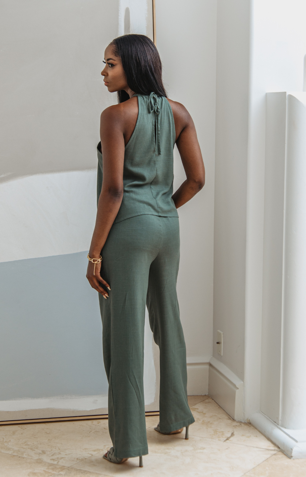 Meet the Mabel Linen Drawstring Pant - your go-to for effortless summer style. This straight-leg linen pant with a drawstring offers chic versatility, perfect for casual or dressed-up looks. Pair with our Mabel Halter Neck Linen Top for a complete ensemble.