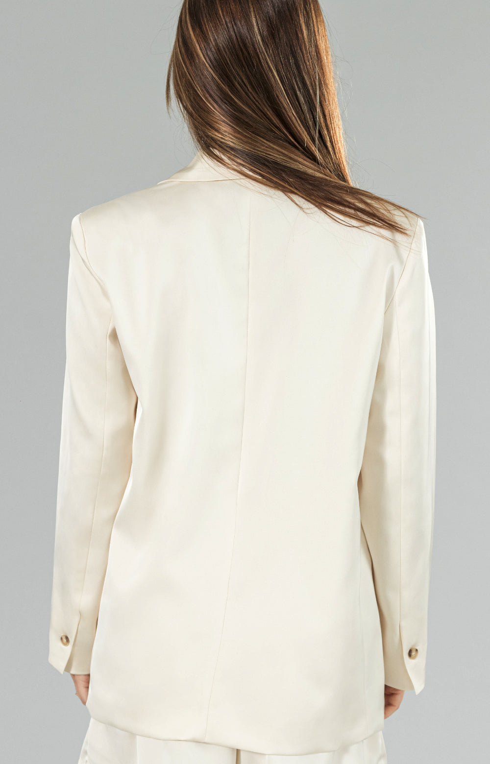 Introducing our newest addition to the blazer family - the satin super soft luxurious blazer! With its elegant design, shoulder pads for added structure, and button front closure, this satin blazer exudes timeless sophistication. The beautiful satin fabric provides a romantic touch, while also being incredibly soft to the touch. Plus, with functional pockets, this elegant blazer is both practical and stylish.