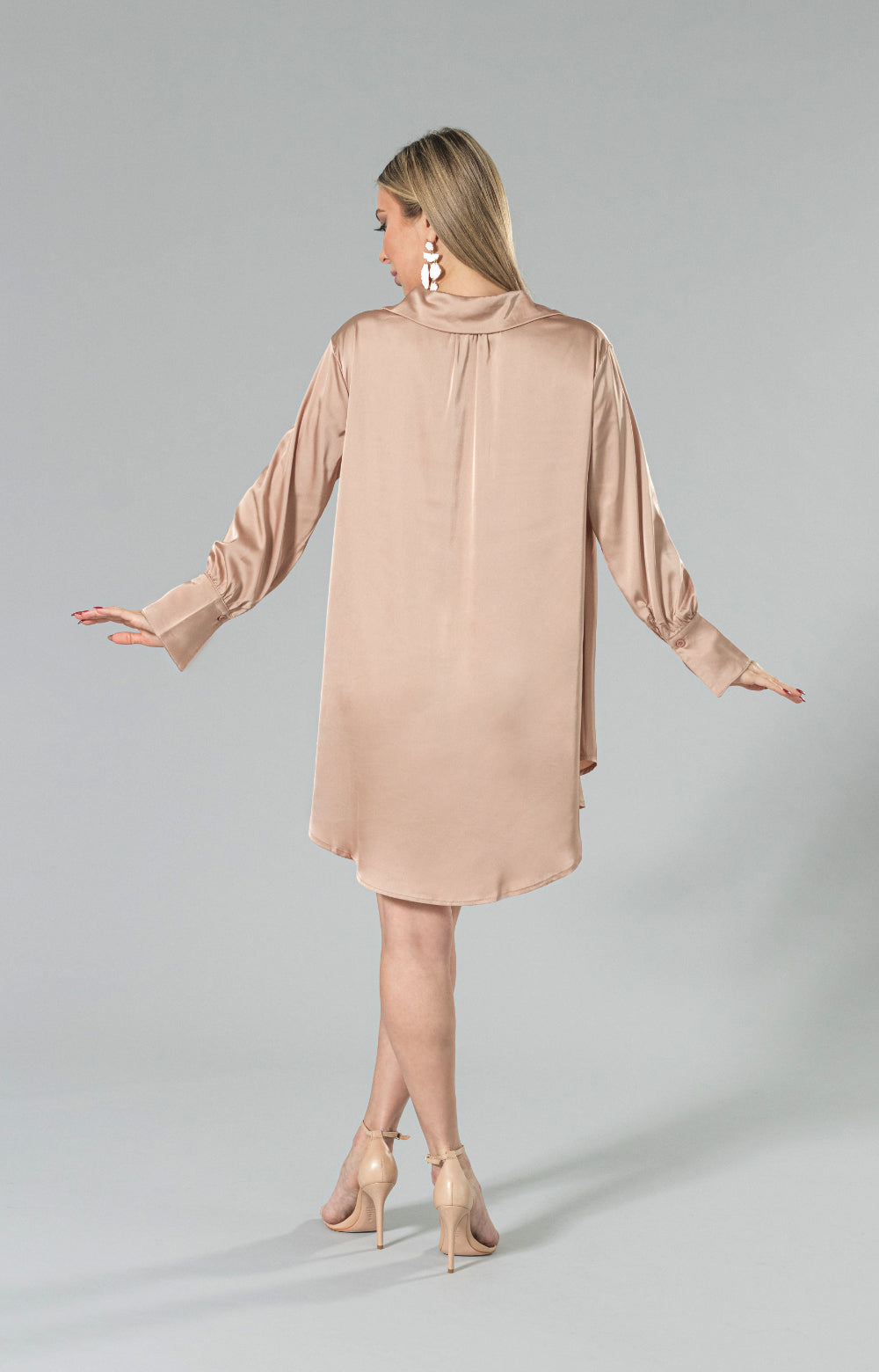 Introducing our stunning Narin satin shirt dress, perfect for any occasion. This versatile piece can be worn as a dress or a shirt, making it a must-have addition to your wardrobe. The luxurious fabric and beautiful color will make you stand out in the crowd. The loose fit and comfortable feel make it ideal for all-day wear. The button down front with a beautiful collar and wide cuffs add a touch of sophistication to this <span data-mce-fragment="1">long shirtdress</span>.