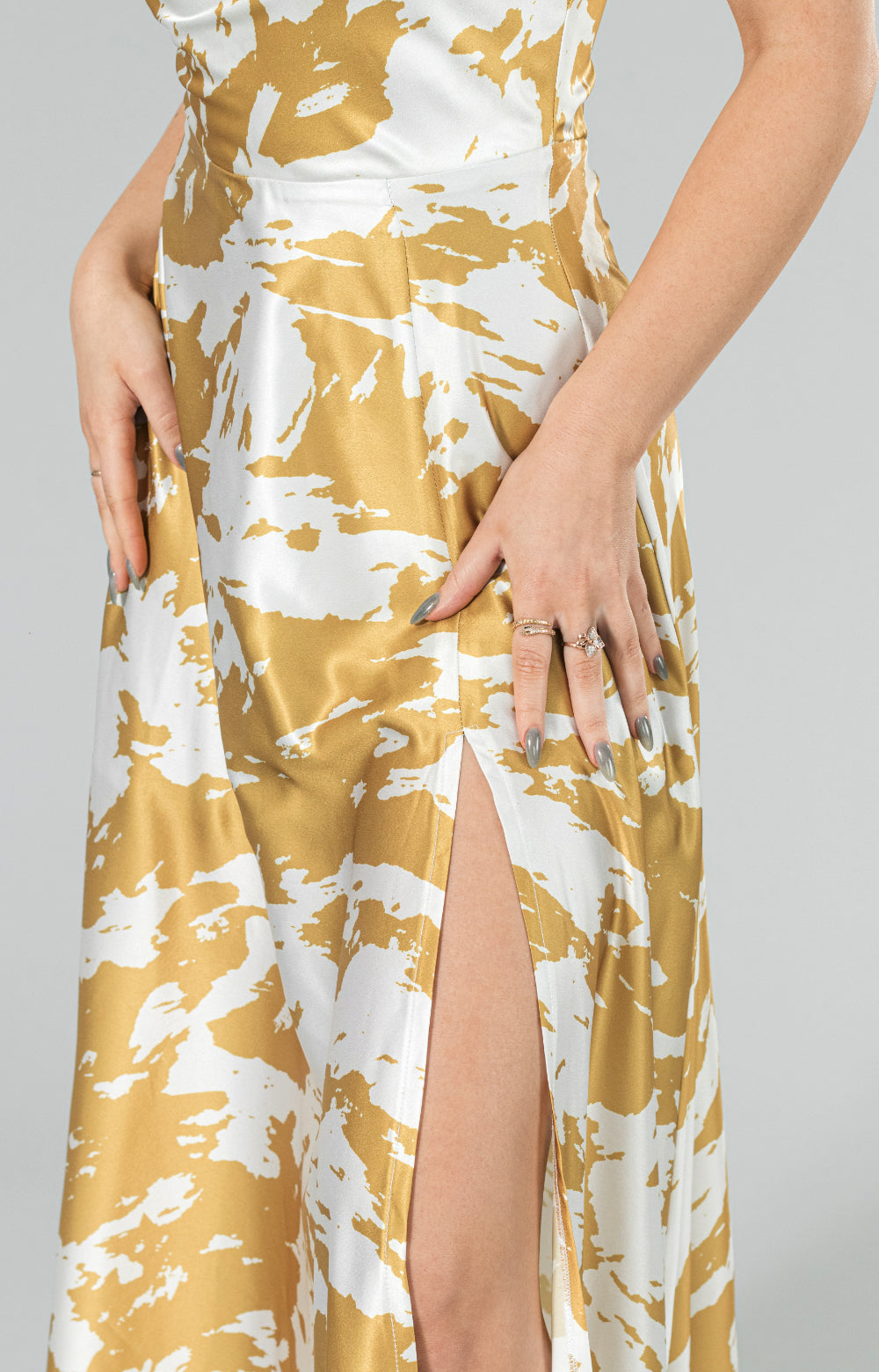 Discover pure elegance and luxury in our Sofia long dress with slit, adorned in a mesmerizing yellow and white pattern. With a flirty front leg slit, alluring strap details and invisible zipper at center back this dress is truly a vision of romantic femininity. Expertly crafted with the finest quality fabric, it exudes an air of extravagance, fitting for any special occasion. Experience the feeling of graceful delicacy and radiate timeless beauty in this enchanting maxi dress.