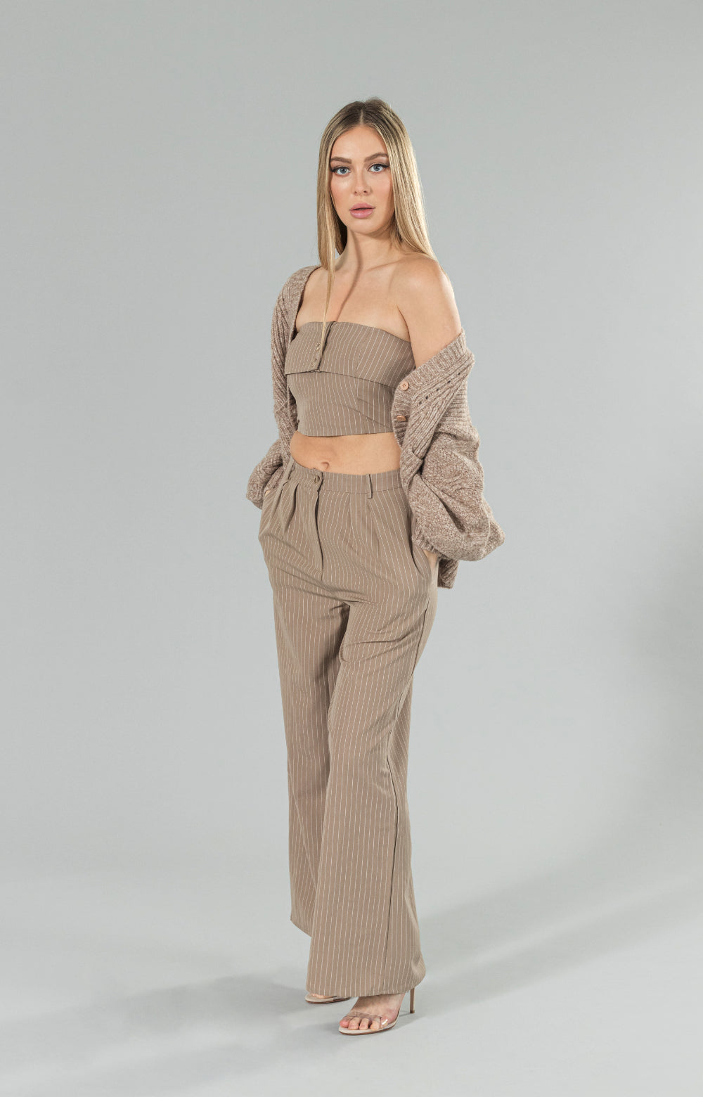Introducing our must-have Beeta wide leg high waisted pants for the season - high waisted and pleated at the front, these pants are designed to flatter your figure and elevate any outfit. With pockets and a wide straight leg, they offer both style and functionality. The beautiful mocha white stripe fabric is both chic and elegant, perfect for dressing up or down. Made from a great fabric, these pants are comfortable and versatile, making them a staple in any fashion wardrobe.&nbsp;