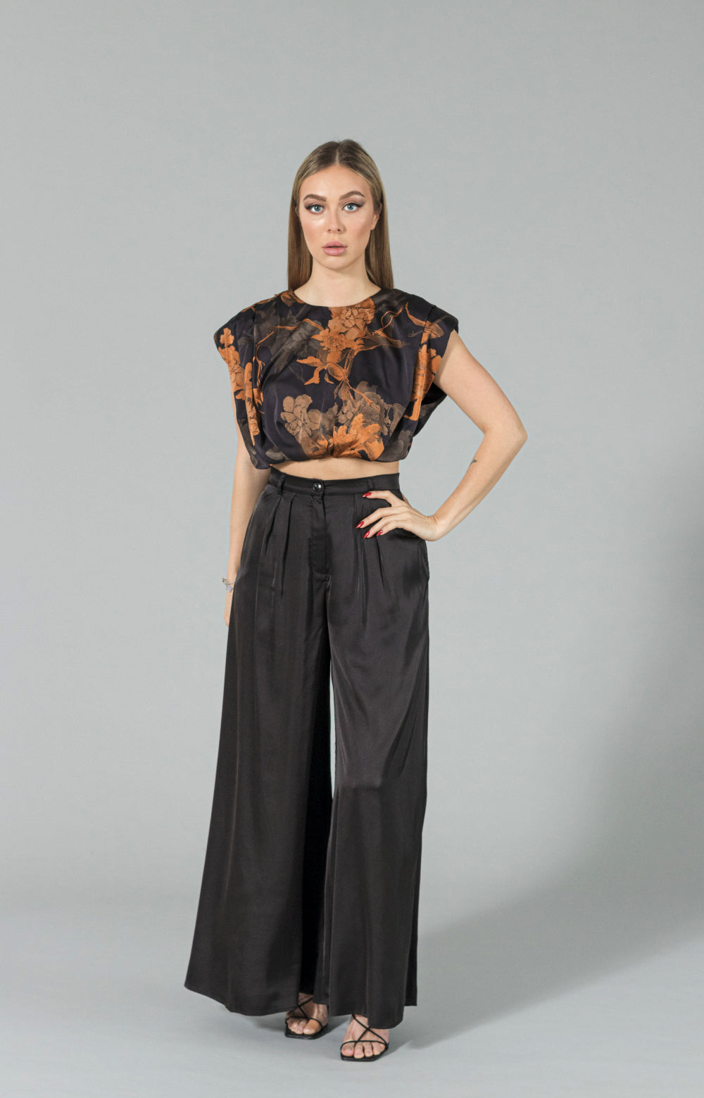 Introducing our latest must-have wardrobe staple, the Marline wide leg pants in luxurious soft satin fabric. These wide leg high waist pants are not only comfortable and flowy, but also have the perfect touch of sophistication. With a high waist and pockets for added functionality, these wide leg pants are versatile for any occasion. Dress them up with our Marlina top for a formal event or pair them with a tank for a more casual look. Elevate your style with our wide leg high waisted pant.