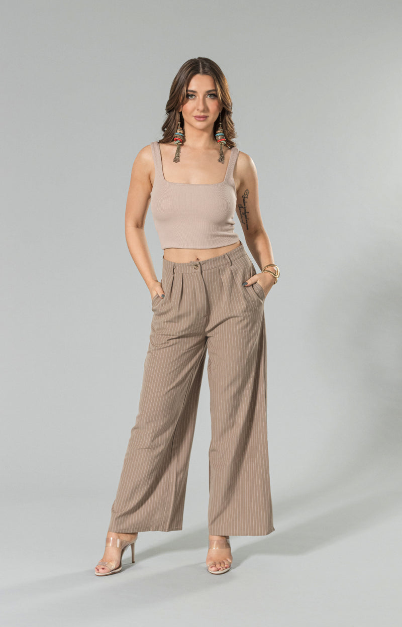 Introducing our Tia rib crop top, your new go-to wardrobe staple! Made from super soft and buttery fabric, this crop top offers unbeatable comfort all day long. With its stretchy material, it provides a wonderful body-hugging fit that flatters your curves. Perfect for everyday wear or dressing up for a night out, this rib crop top will quickly become a must-have in your closet.