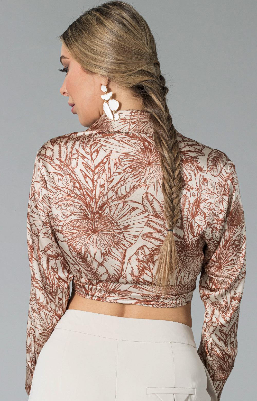Elevate your wardrobe with our stunning Celine long sleeve tie front top. The soft and luxurious fabric drapes beautifully, adding an elegant touch to any outfit. Featuring a gorgeous print, this shirt is perfect for any occasion, whether you're dressing up for a night out or adding a touch of glamour to everyday wear. The tie front top detail adds a unique and flattering element to the design, making this long sleeve blouse a must-have in any fashion-forward closet.