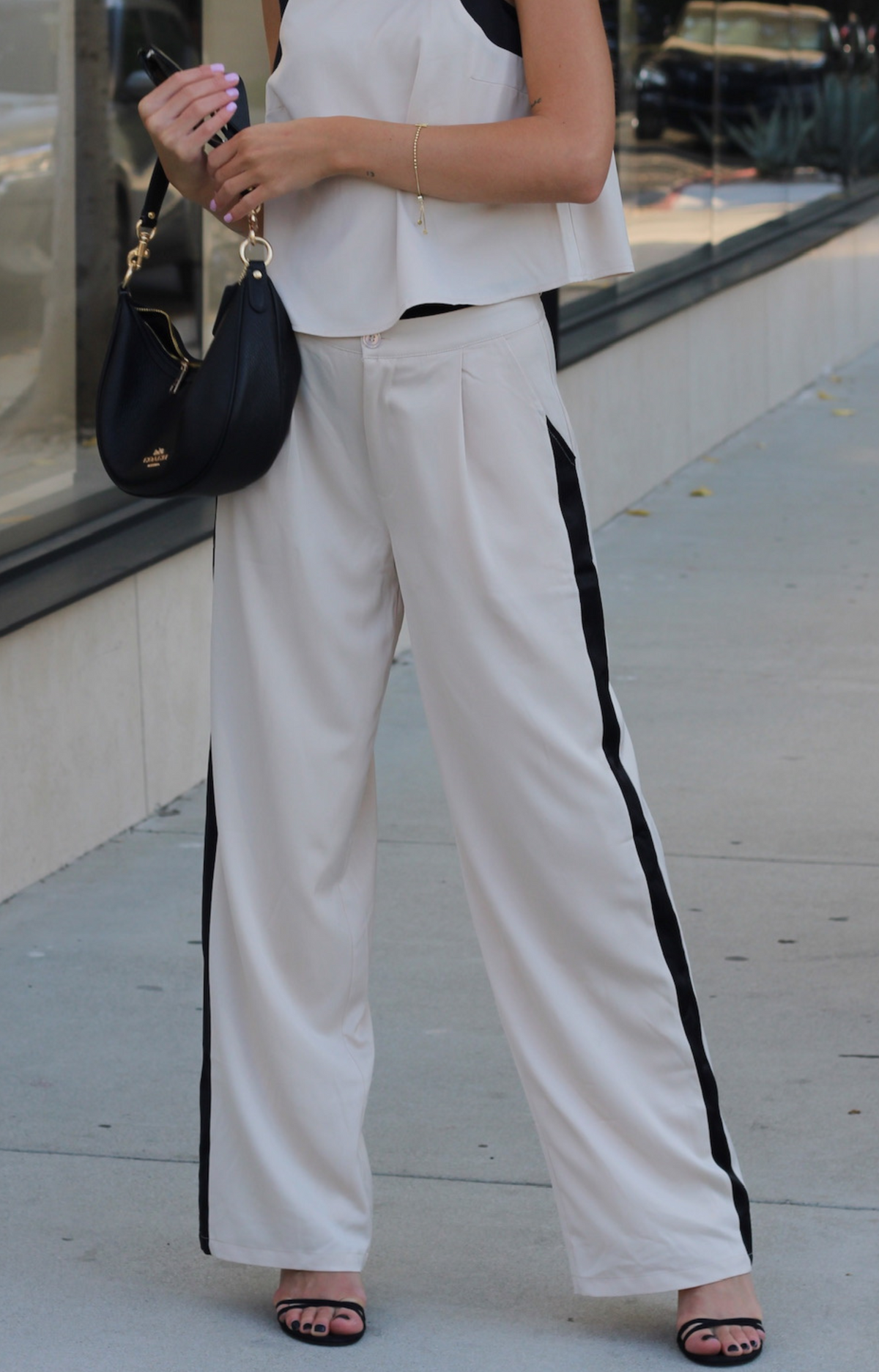 Elevate your wardrobe with our Tiera Tailored long satin feel pants, designed for both style and comfort. Featuring a straight leg cut for a flattering silhouette, this tailored pant includes practical pockets and stylish front pleats that enhance the fit. Crafted from luxurious fabric with eye-catching color block detail, they are perfect for any occasion, from casual outings to sophisticated events. Discover the perfect blend of elegance and functionality with our stunning Tiera Tailored Pant.
